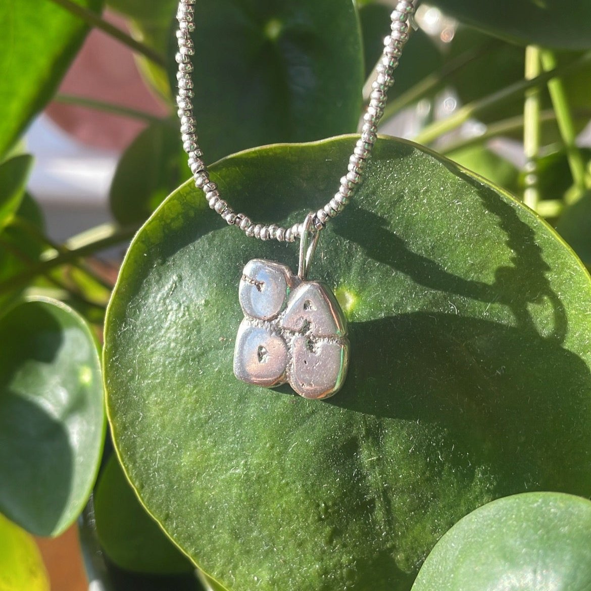 JADU signature pendant